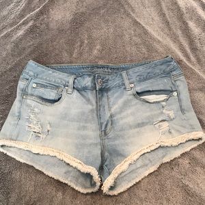 Light blue denim shorts with white trim